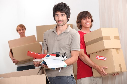 Transporting boxes and household items with a Richmond upon Thames van team