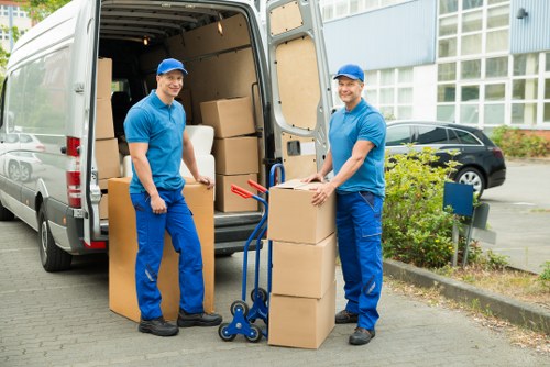 Professional movers handling furniture in a Richmond flat